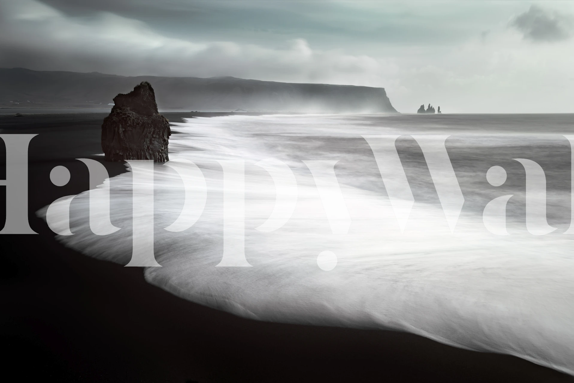 Monochrome wall mural depicting a dark beach with foamy waves