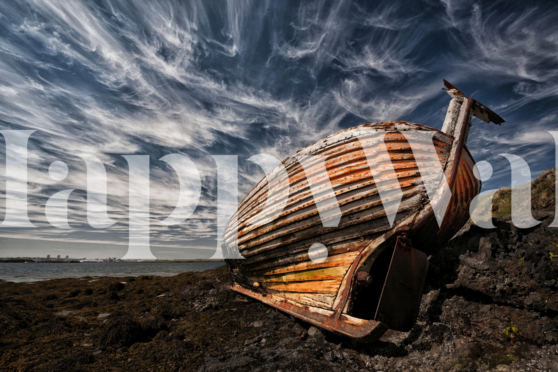 Abandoned wooden boat on rocky shore with dramatic clouds wallpaper