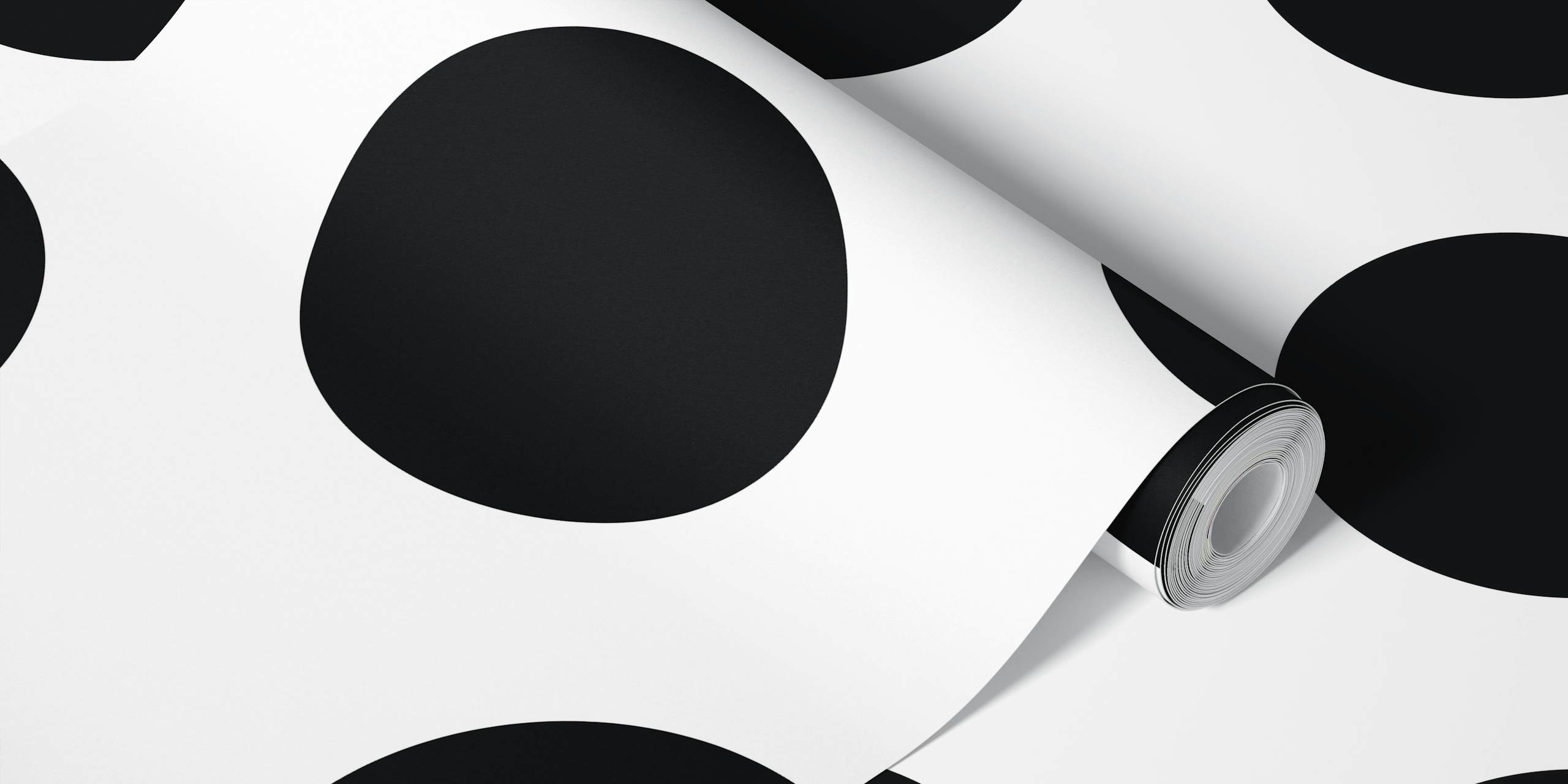 Black and white polka dots wallpaper in a room
