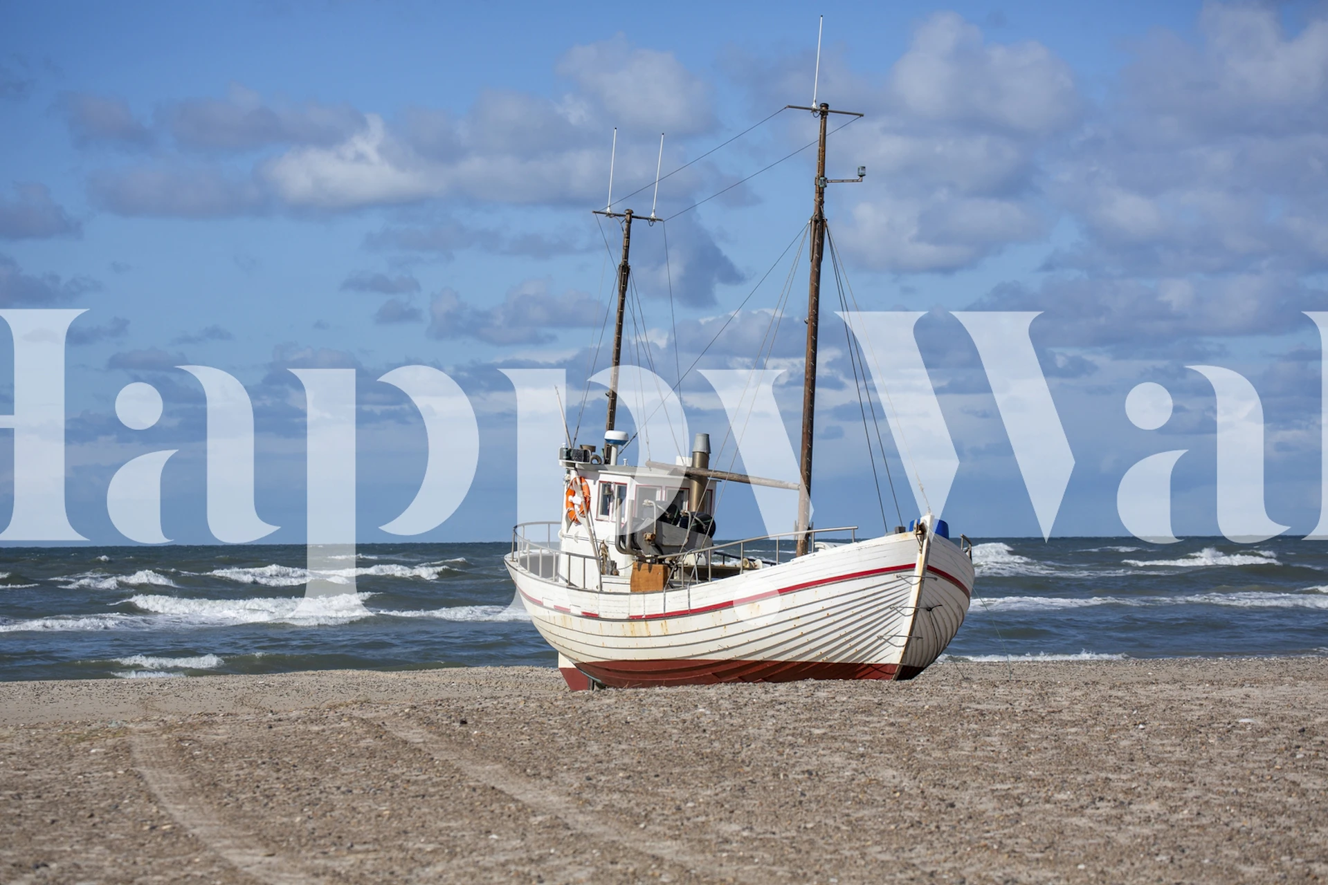 Fishing boat on beach with waves and blue sky wallpaper