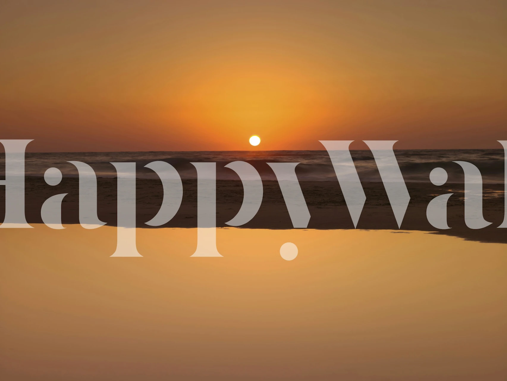 Sunset over the ocean with golden and orange hues wallpaper