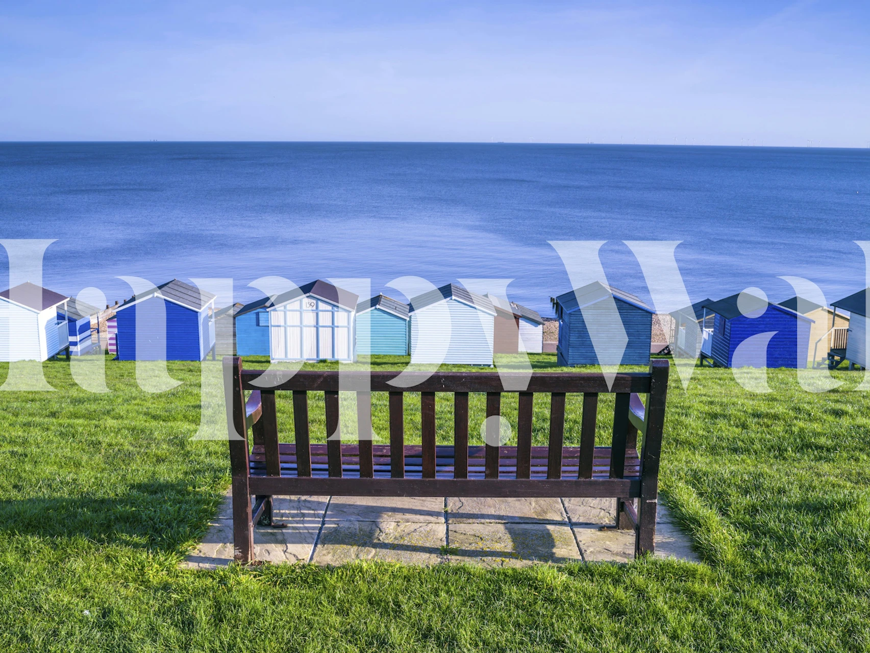 Coastal Idyll wallpaper featuring beach huts