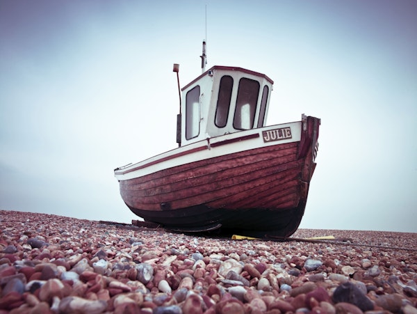 Boat Resting on Pebbled Strand