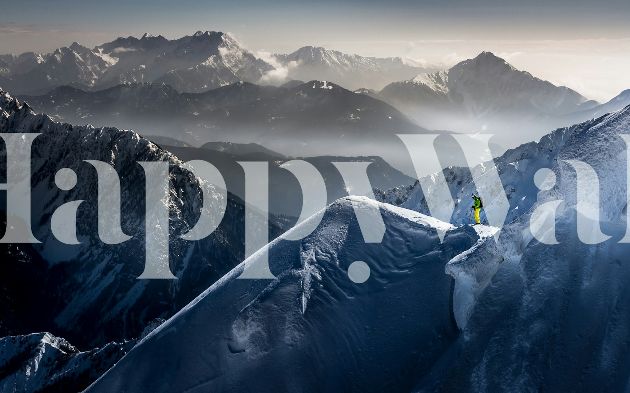 Skier on mountain peak wall mural Silence before Descent with misty mountain backdrop