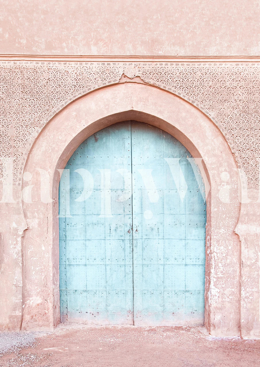 Blue door with intricate arch and pink textured wall wallpaper