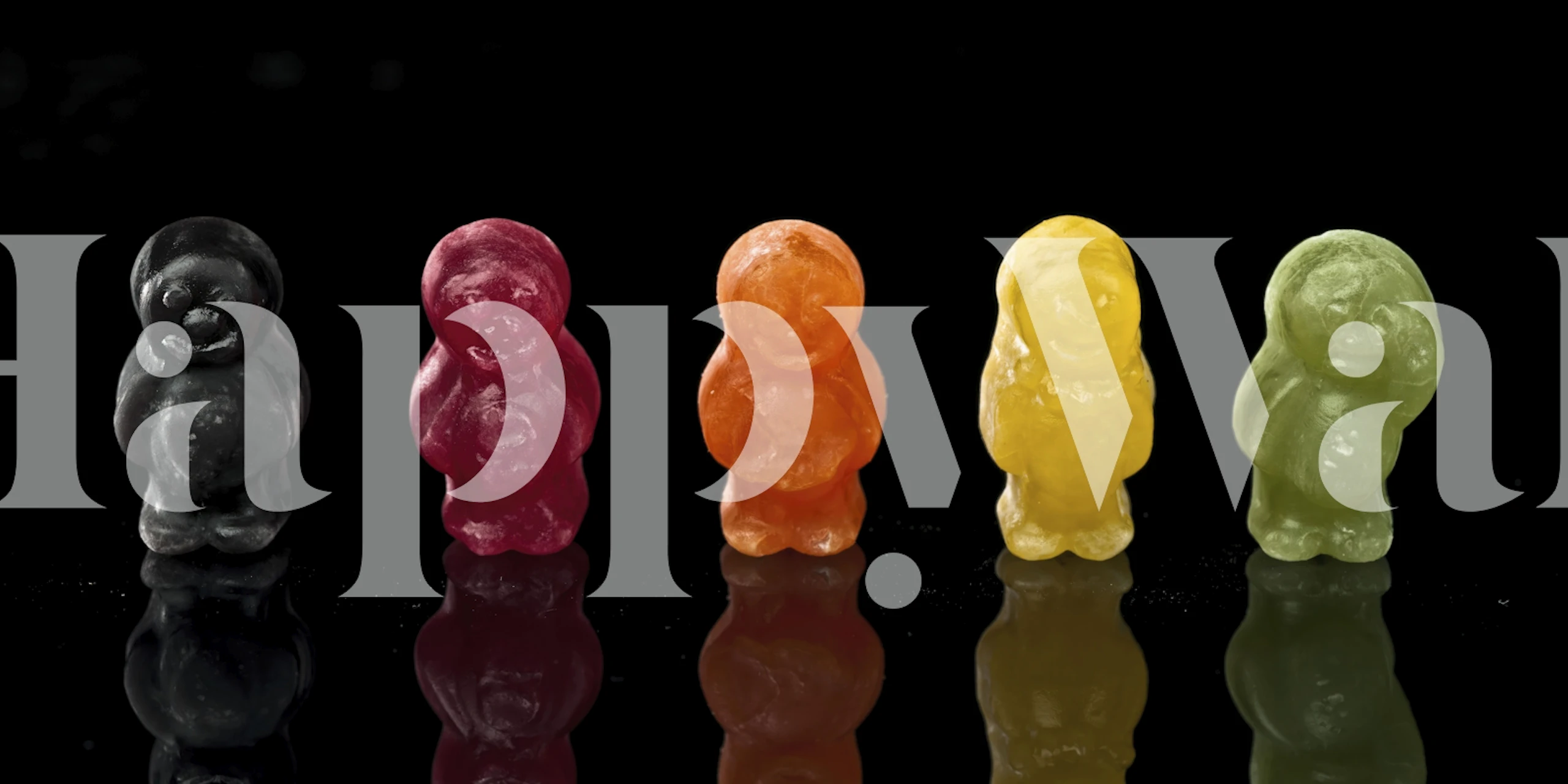 Colorful jelly baby candies wall mural on a dark background