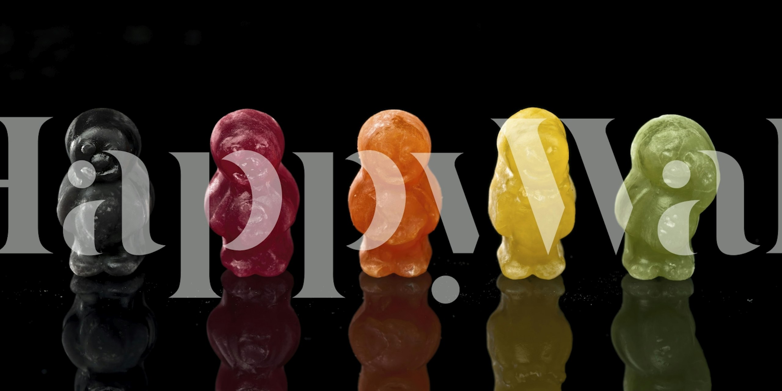 Colorful jelly baby candies wall mural on a dark background