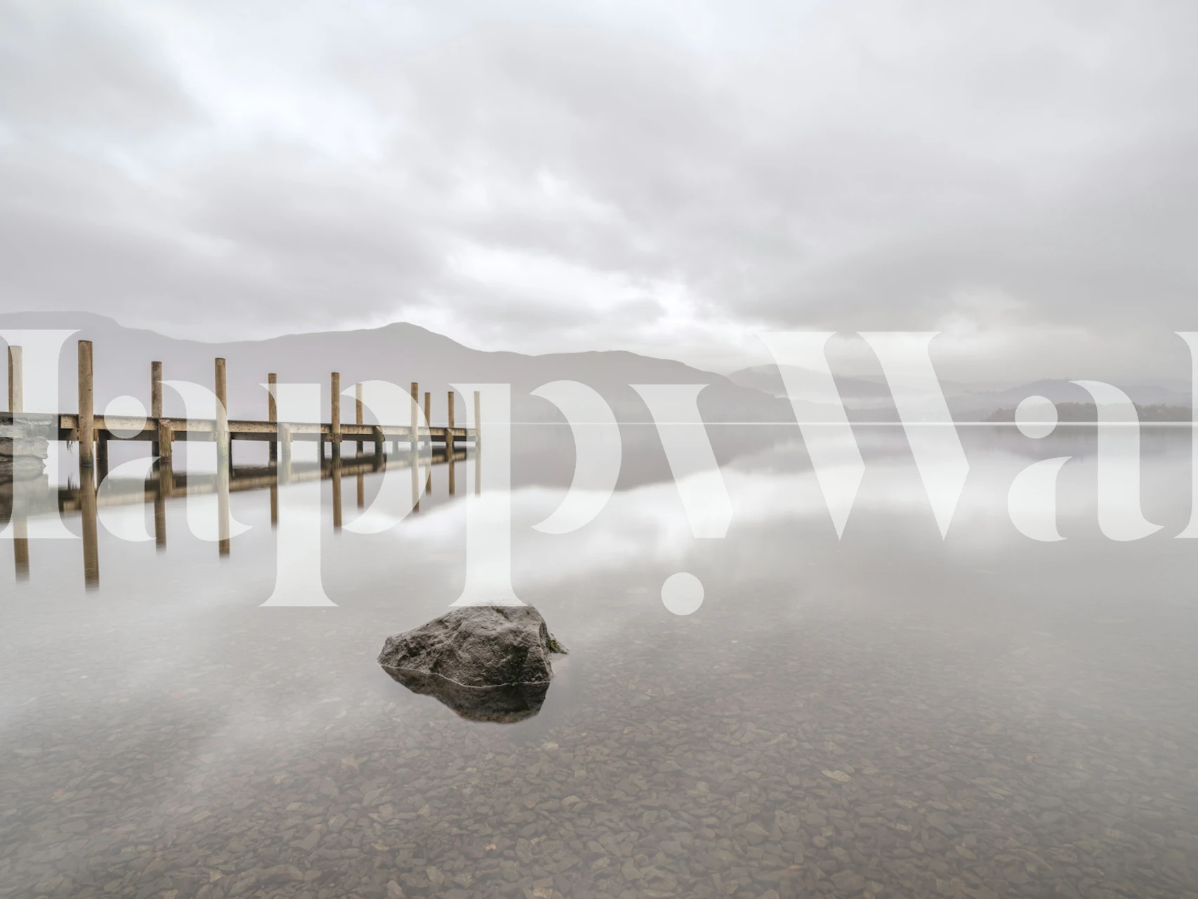 Serene lake with wooden pier and soft gray tones wallpaper