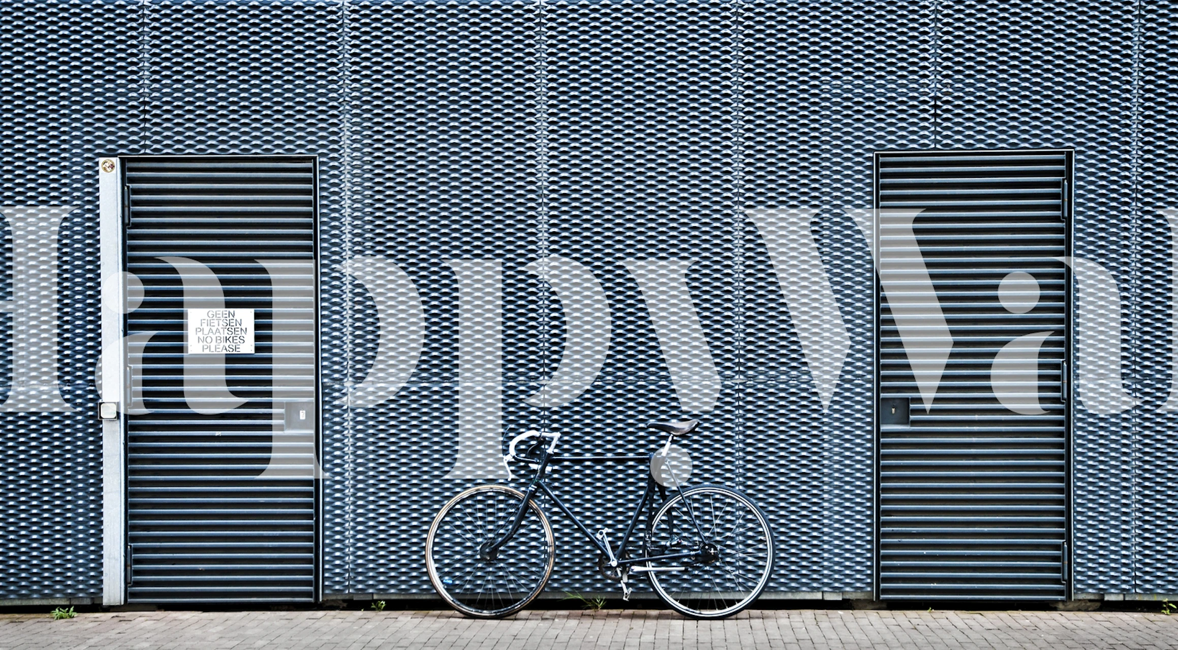 Blue geometric pattern wall mural with bike-themed design