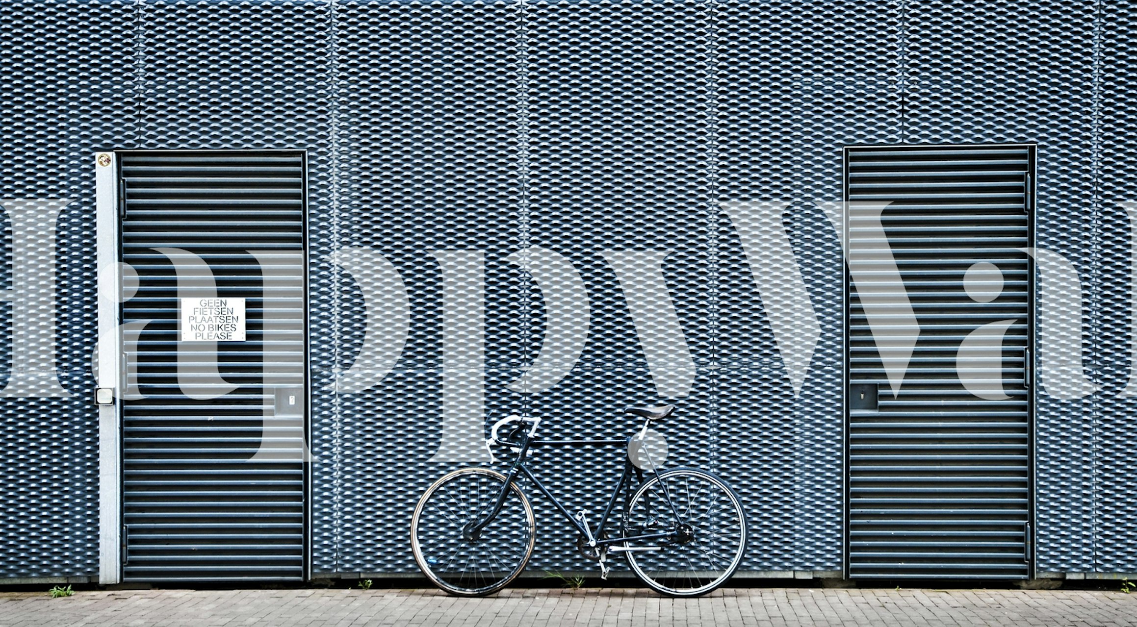 Blue geometric pattern wall mural with bike-themed design