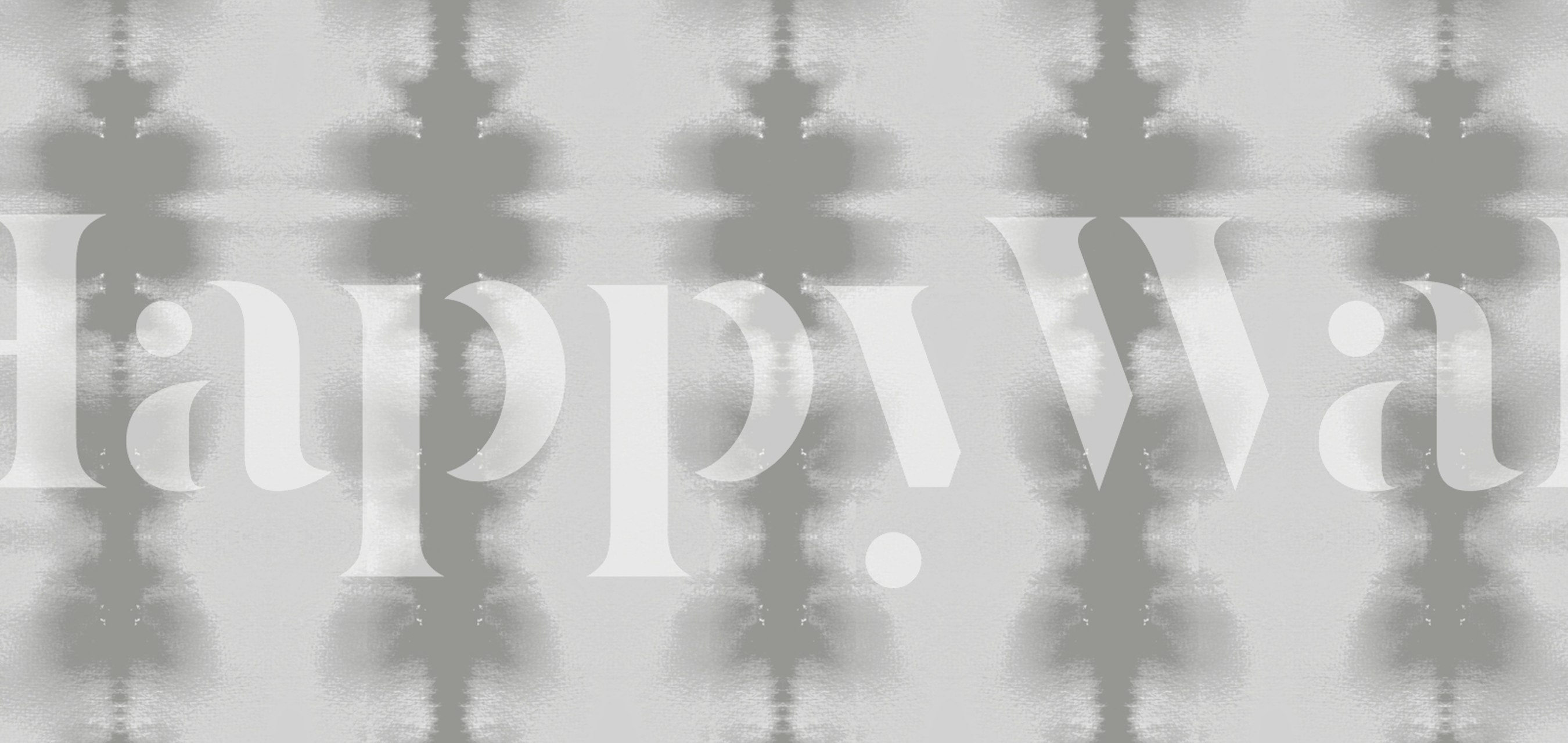 Mural de parede com padrão geométrico abstrato em tons de cinza, criando um ambiente zen