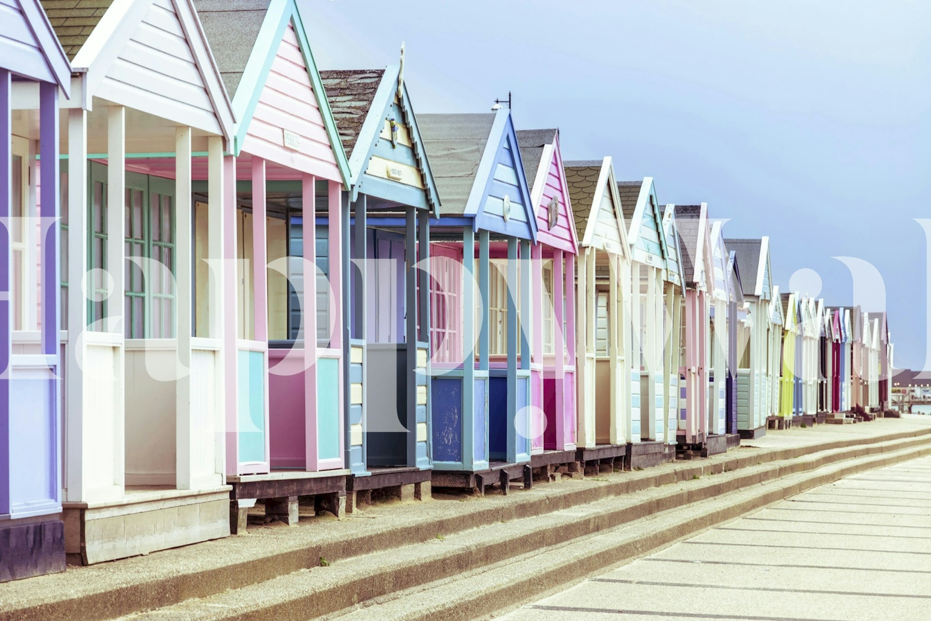 Vibrant Beach Huts wallpaper in a room