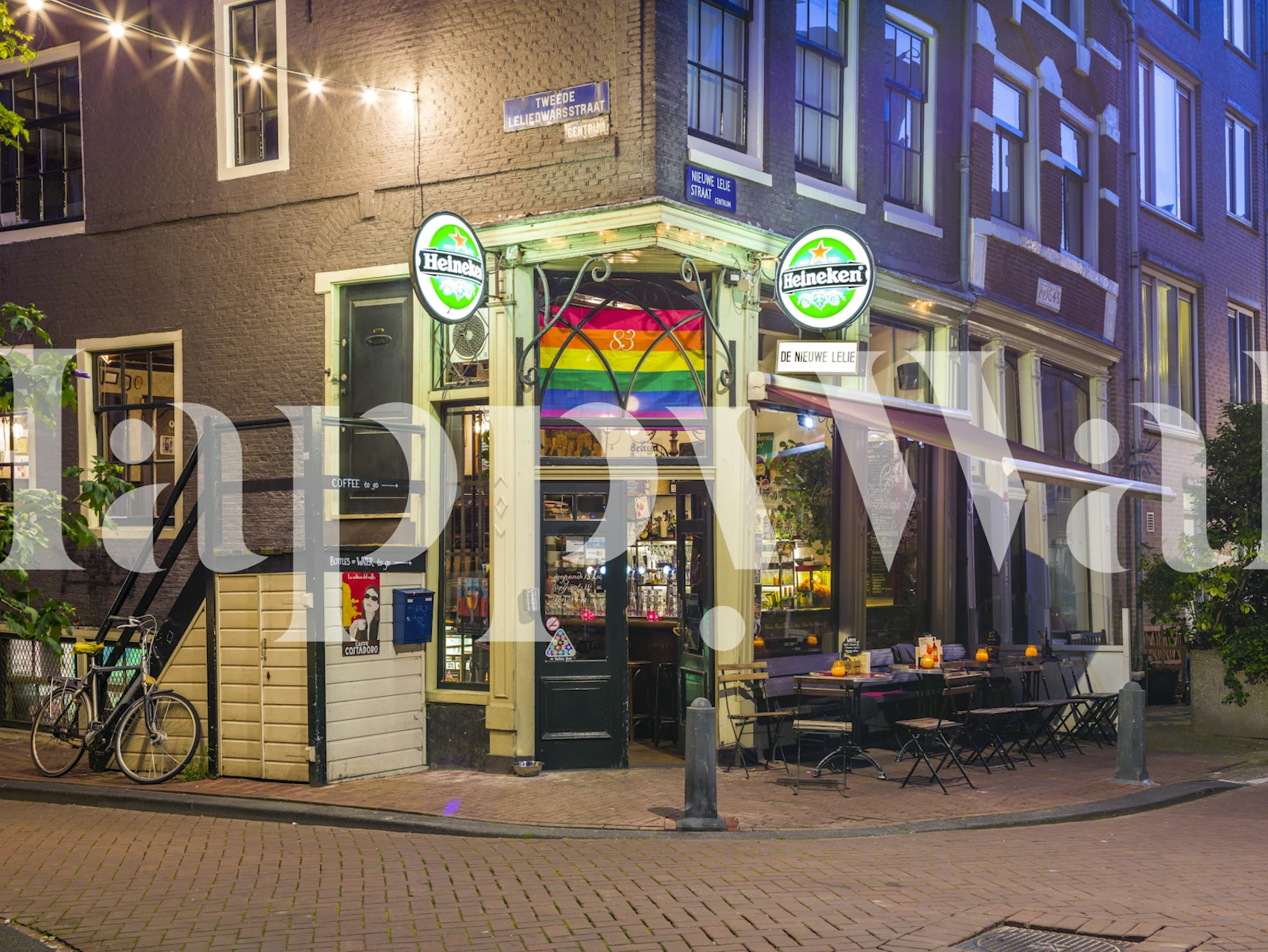 Street view of a Cozy Corner Cafe wall mural with illuminated café front at twilight