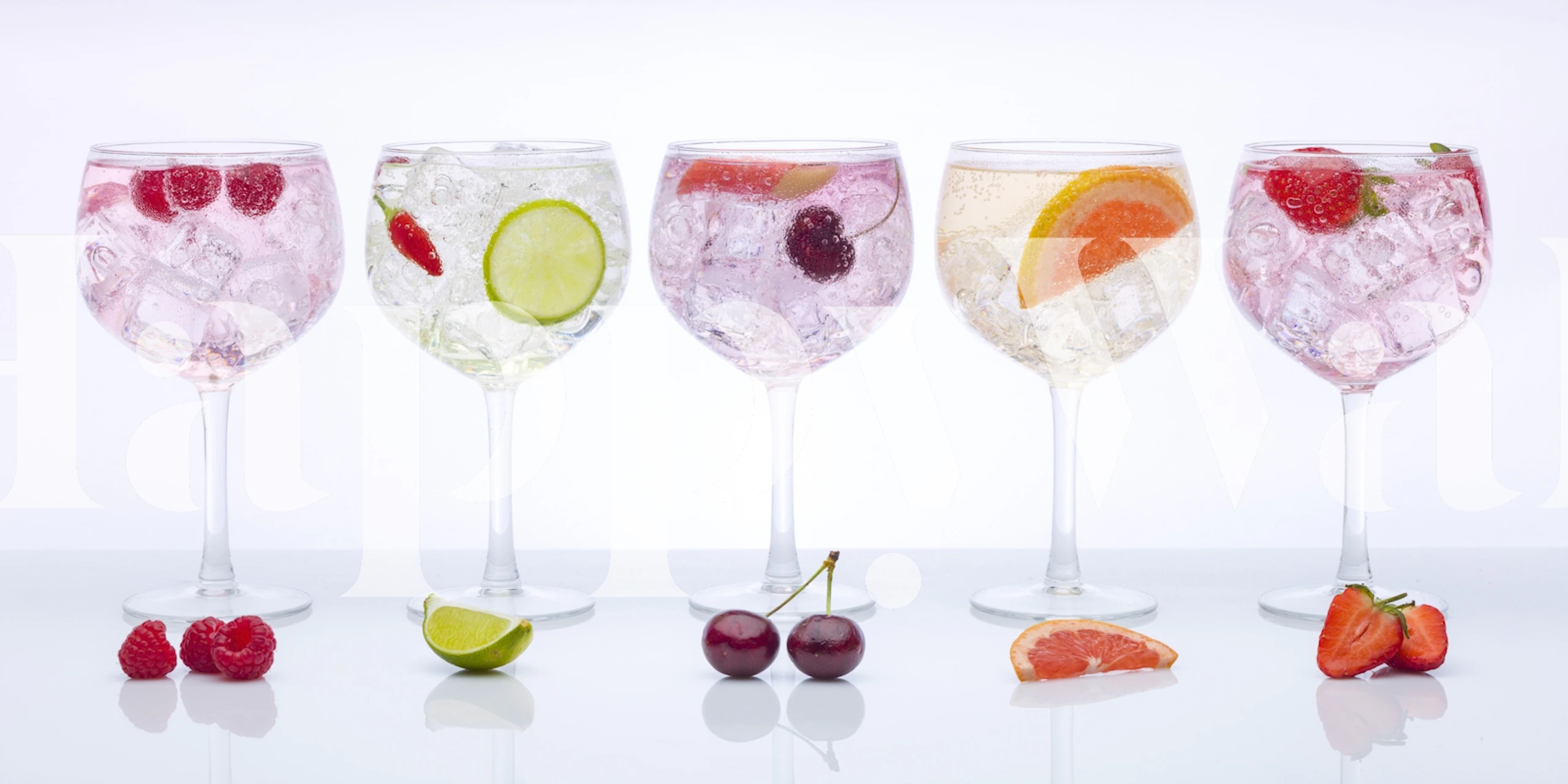 Colorful cocktails in glasses with ice and fruits wallpaper