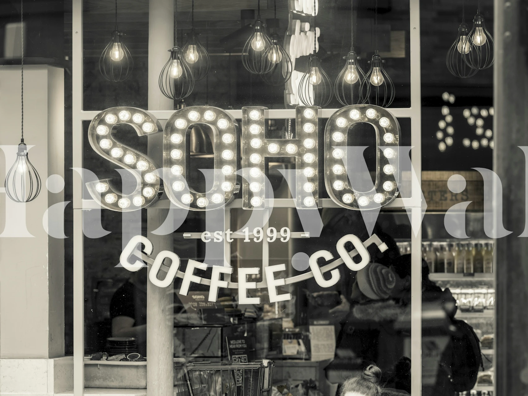 Soho Coffee Co wall mural with illuminated signs in black and white