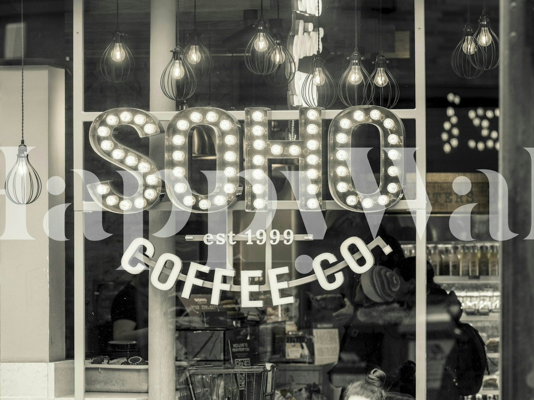 Soho Coffee Co wall mural with illuminated signs in black and white