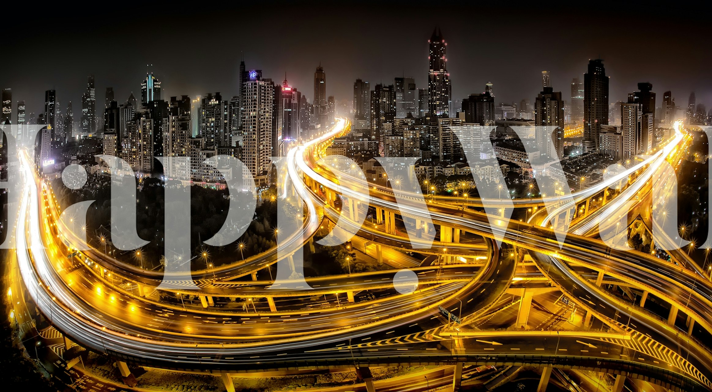 Shanghai night cityscape with bright lights and highways wallpaper