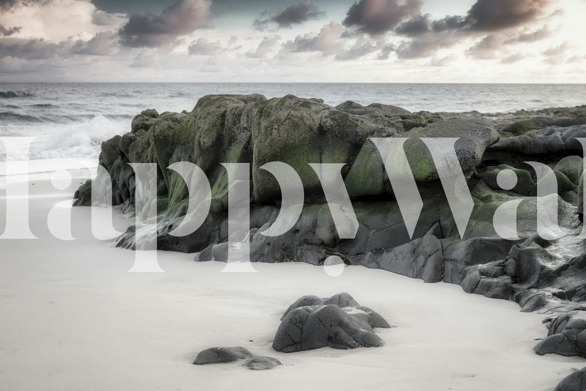 Tranquil beach scene with rocks wall mural
