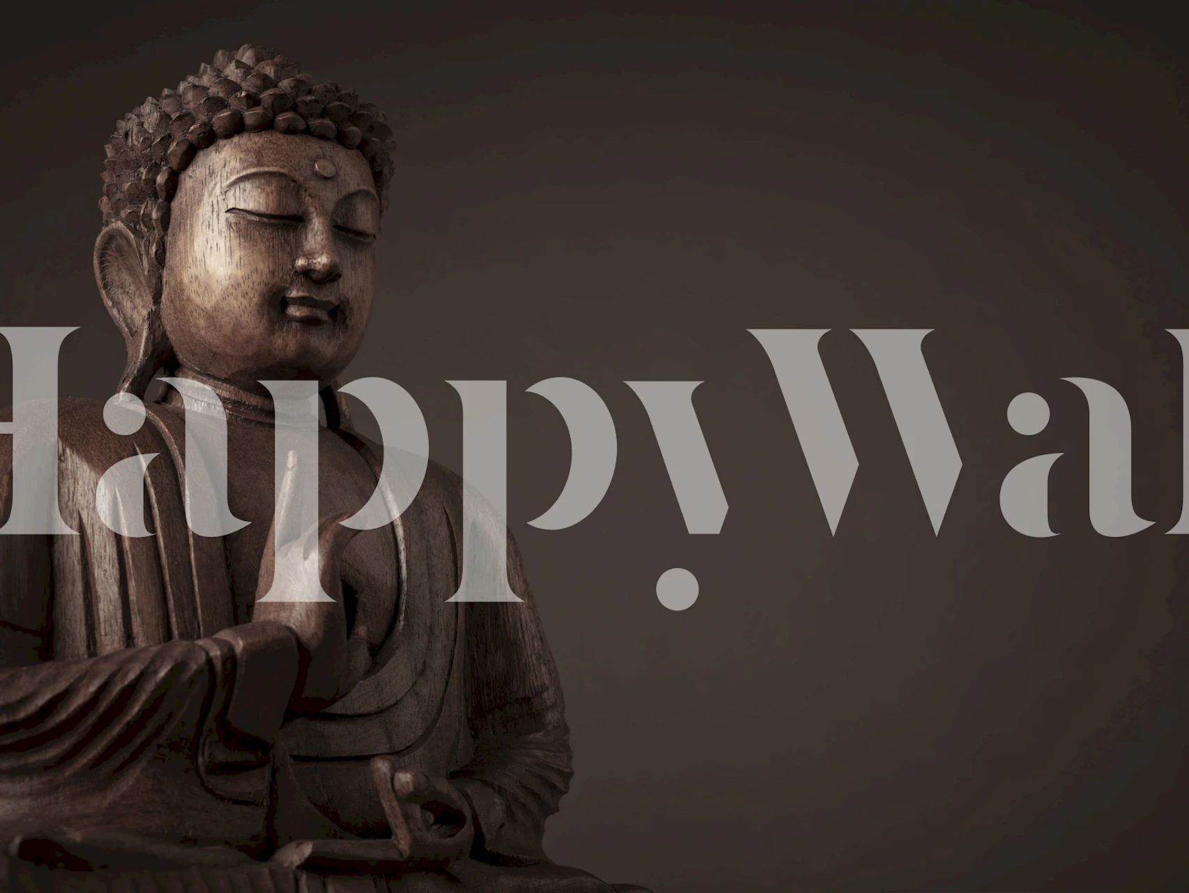 Buddha statue with intricate details on dark background wallpaper