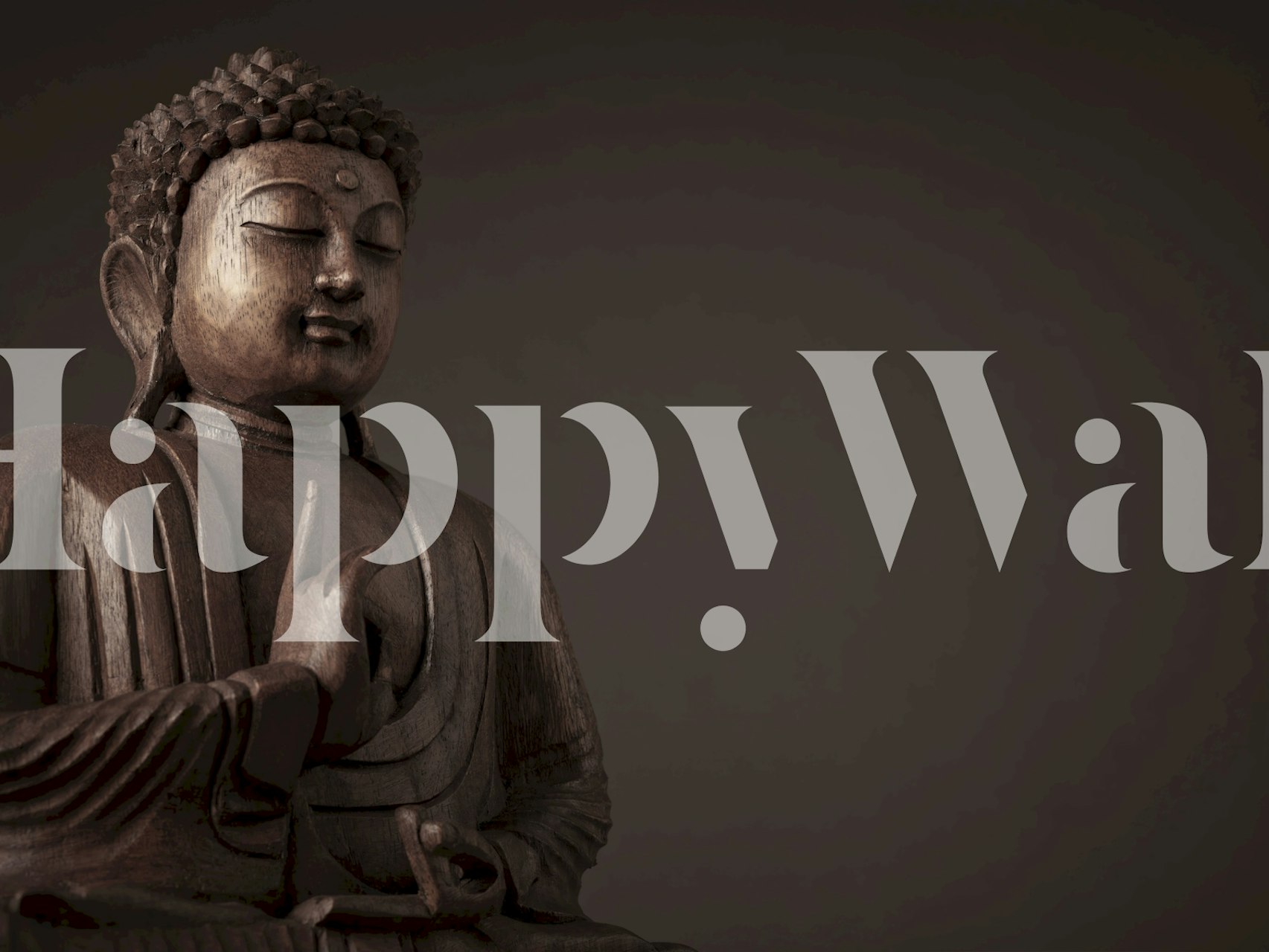 Buddha statue with intricate details on dark background wallpaper