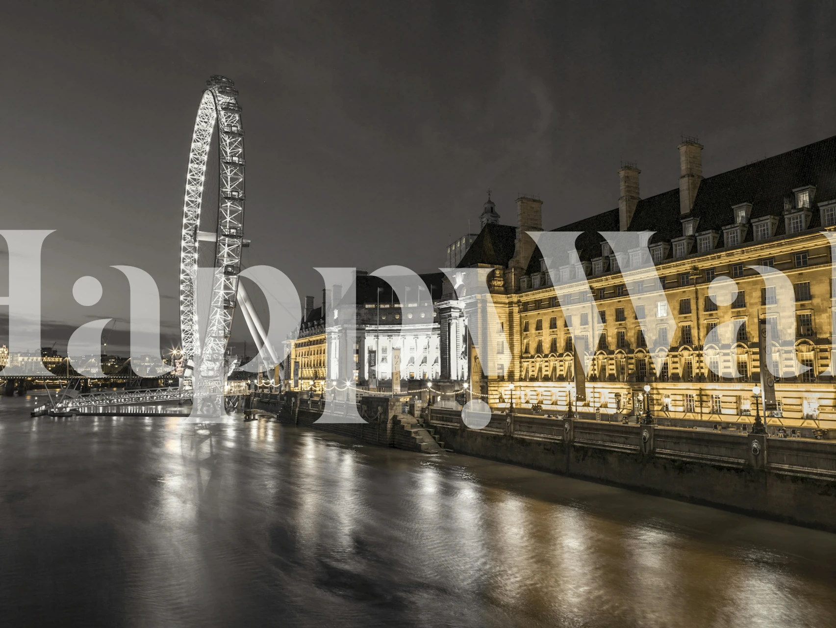 Monochrome wall mural of the London County Hall and London Eye along the South Bank at night