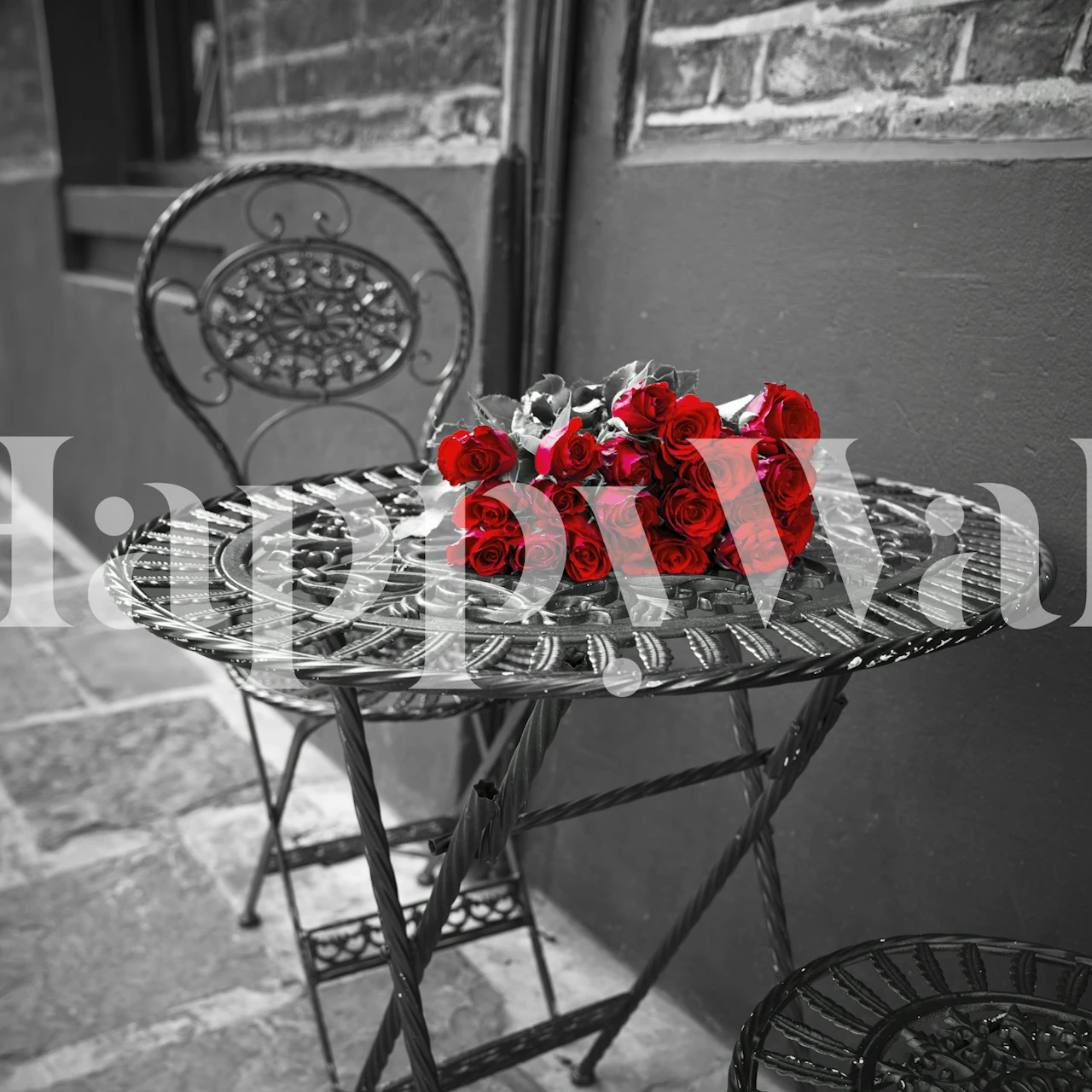 Red roses on wrought-iron table against black and white background wall mural