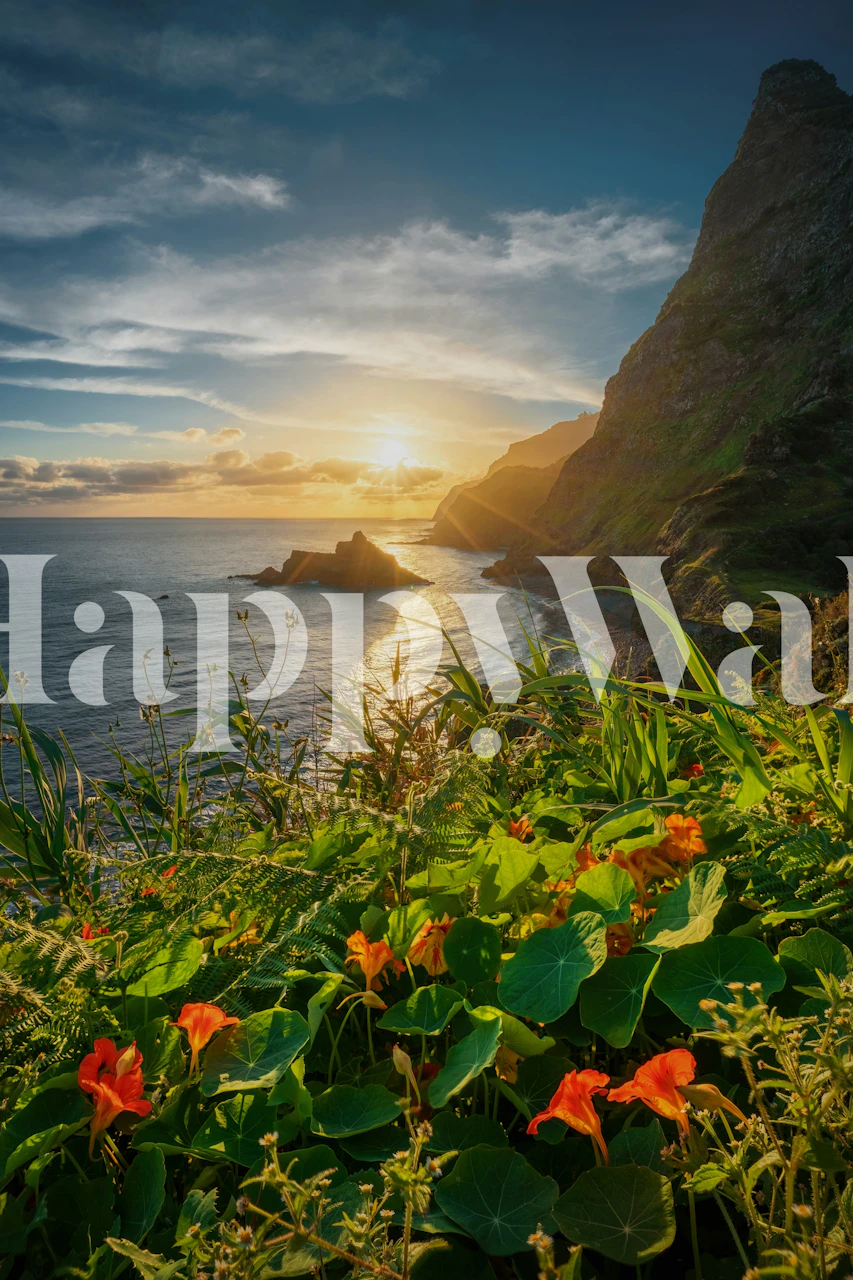 Sunrise over a calm ocean with vibrant tropical flowers and lush greenery on a coastal cliff wall mural