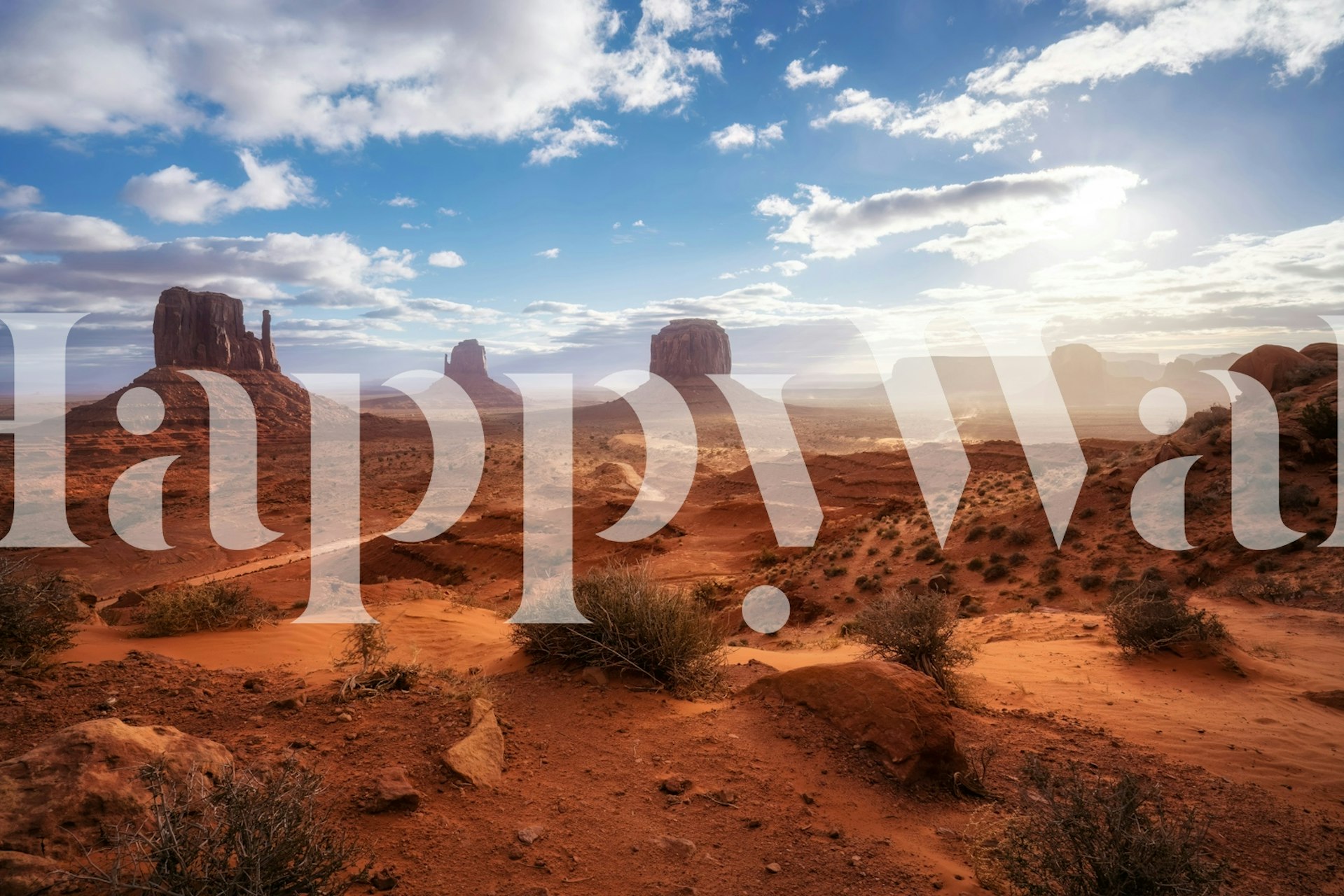 Photo murale de Monument Valley avec des buttes de grès rouge sous un ciel nuageux