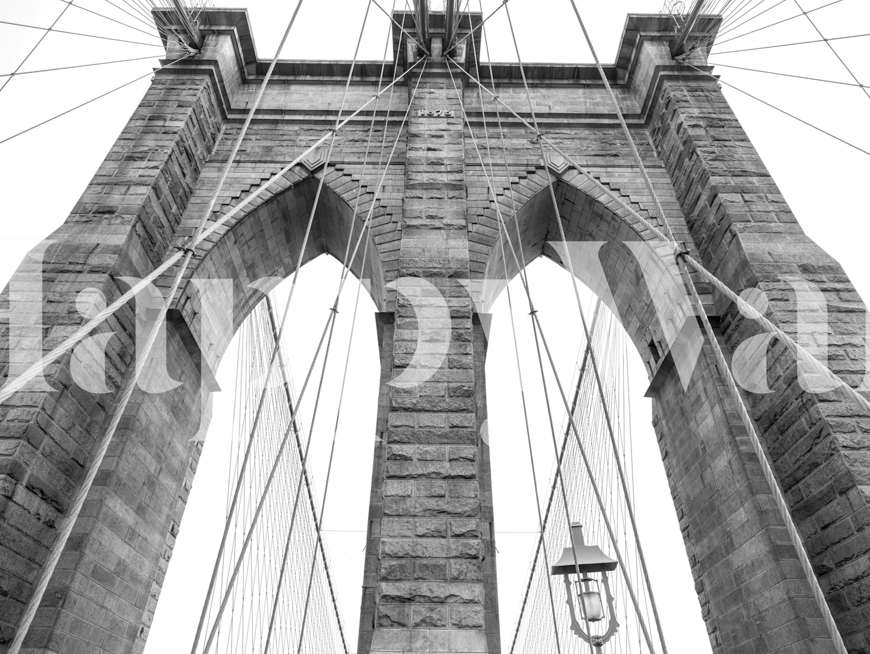 Monochrome wall mural of a historic bridge, creating an architectural focal point