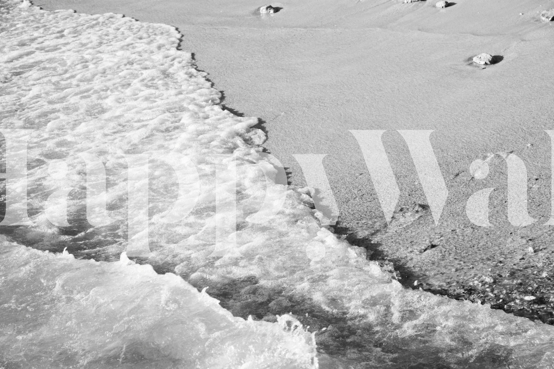 Seafoam wave patterns on sandy beach with soft textures wallpaper