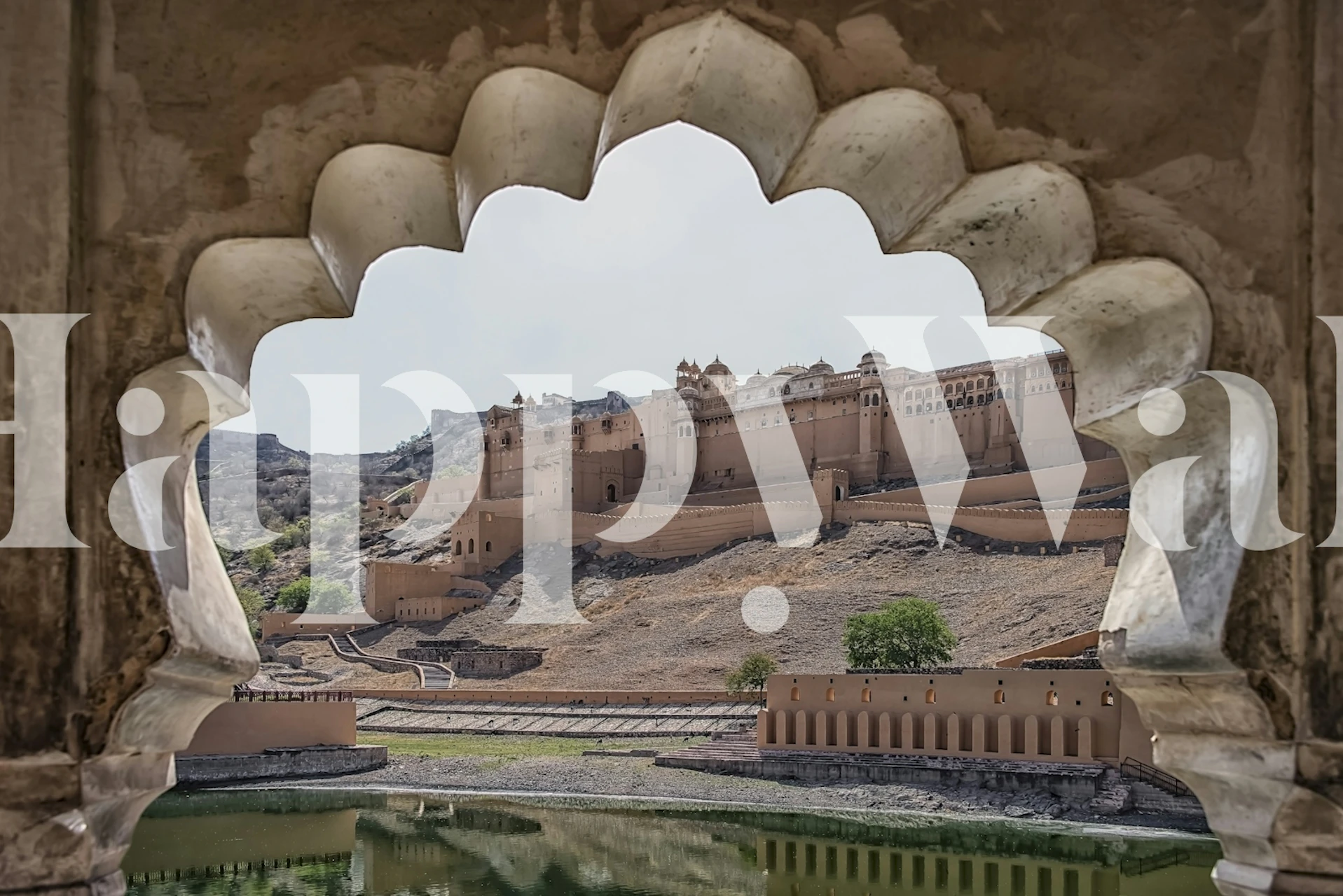 Landscape view of Jaipur Fort framed by architectural details. Nature and historic elements in beige and green wallpaper.