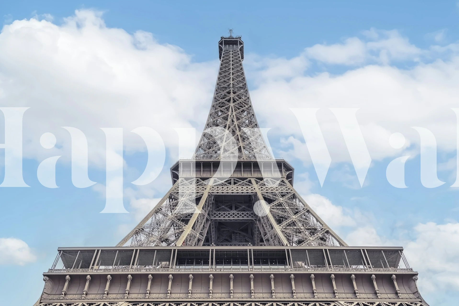 Eiffel Tower against a blue sky wallpaper