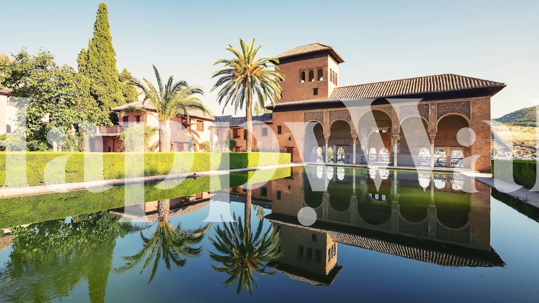 Lush green garden with palms and historical building reflection wallpaper