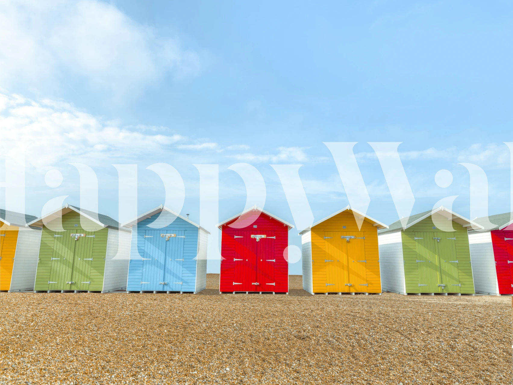 Colorful beach huts lined up against a blue sky wallpaper