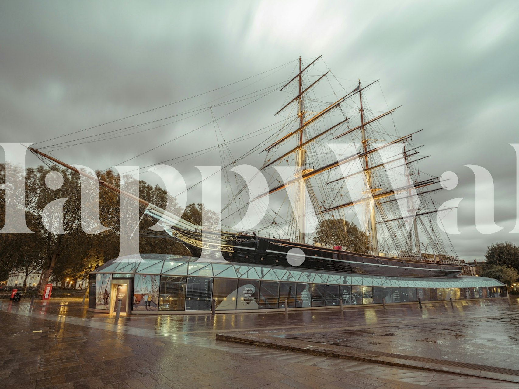 Historic sailing ship Cutty Sark with gray sky wallpaper