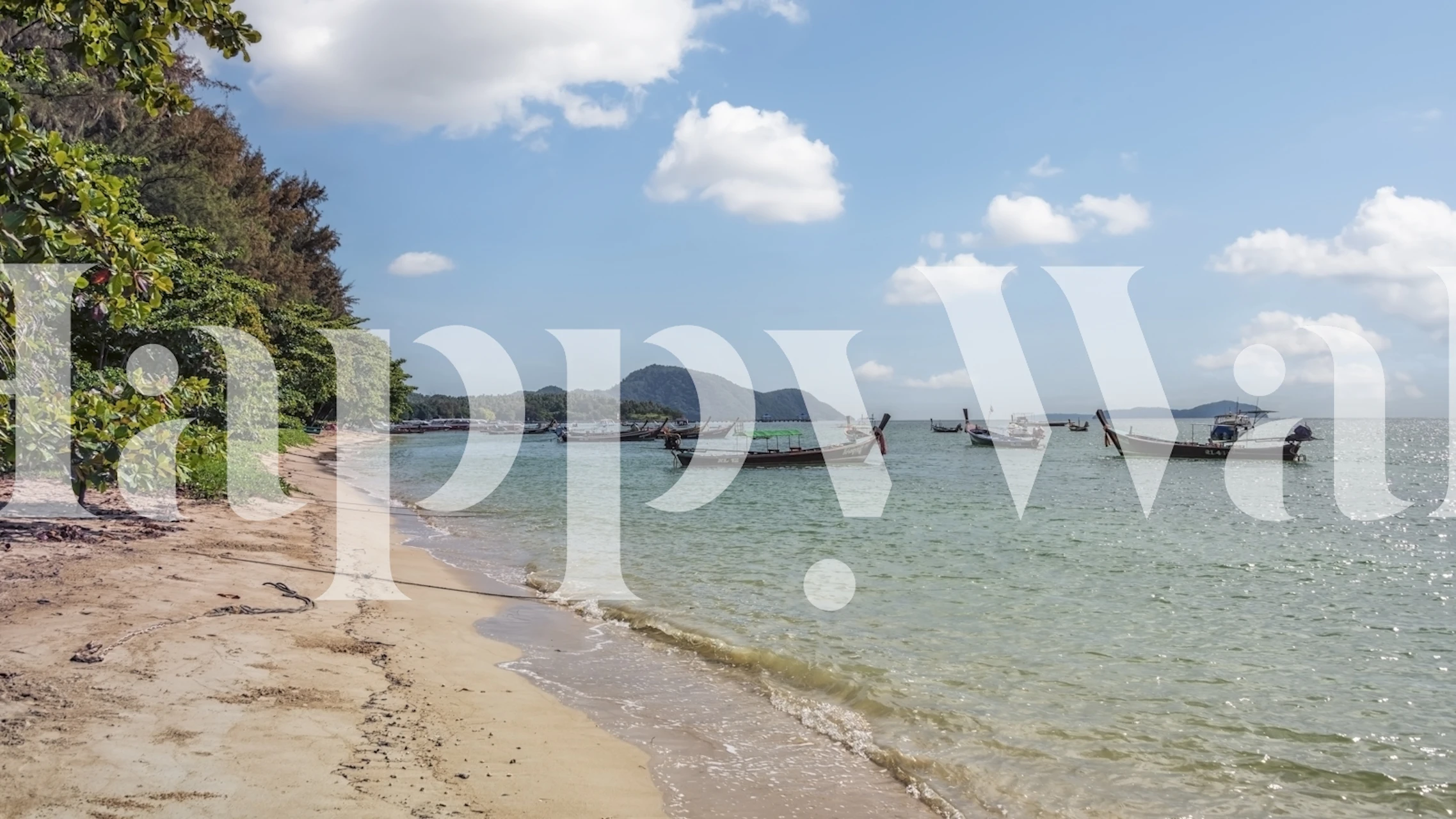 Tropisk strand og både