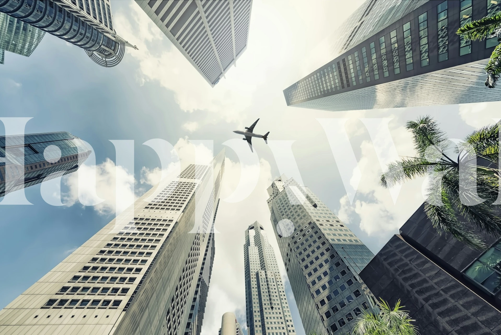 Aerial view of urban high-rises and airplane in the sky wallpaper