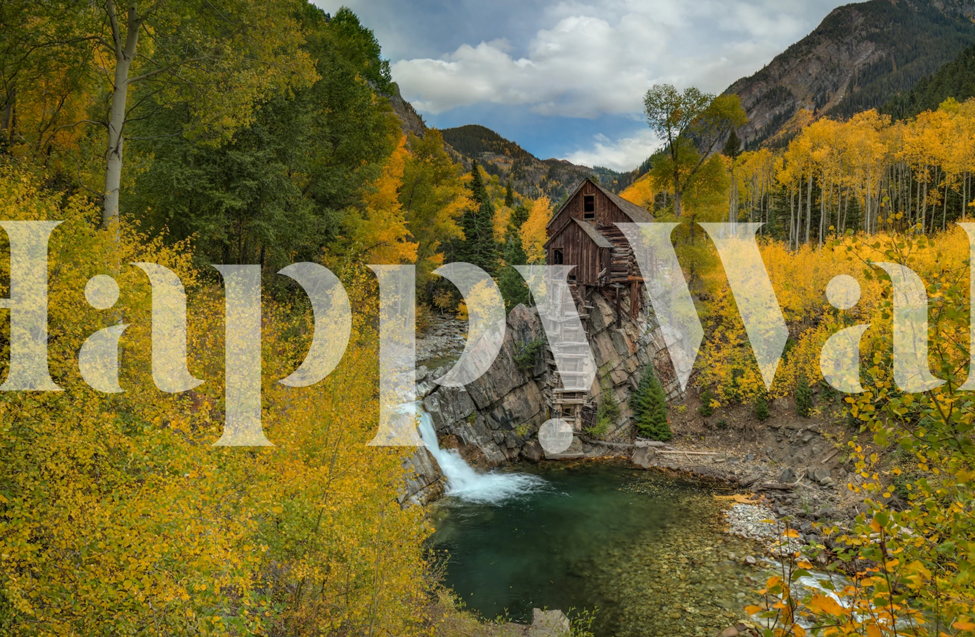 Rustic autumn landscape with yellow trees and a wooden cabin wallpaper