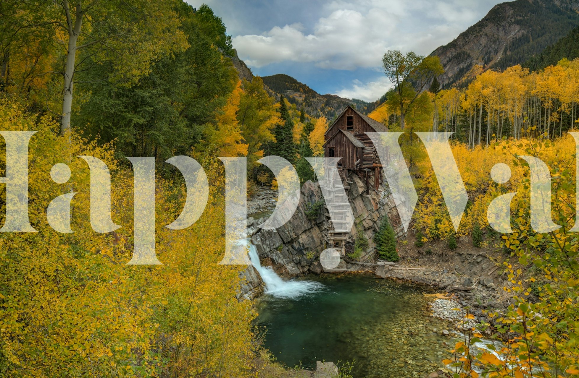 Rustic autumn landscape with yellow trees and a wooden cabin wallpaper