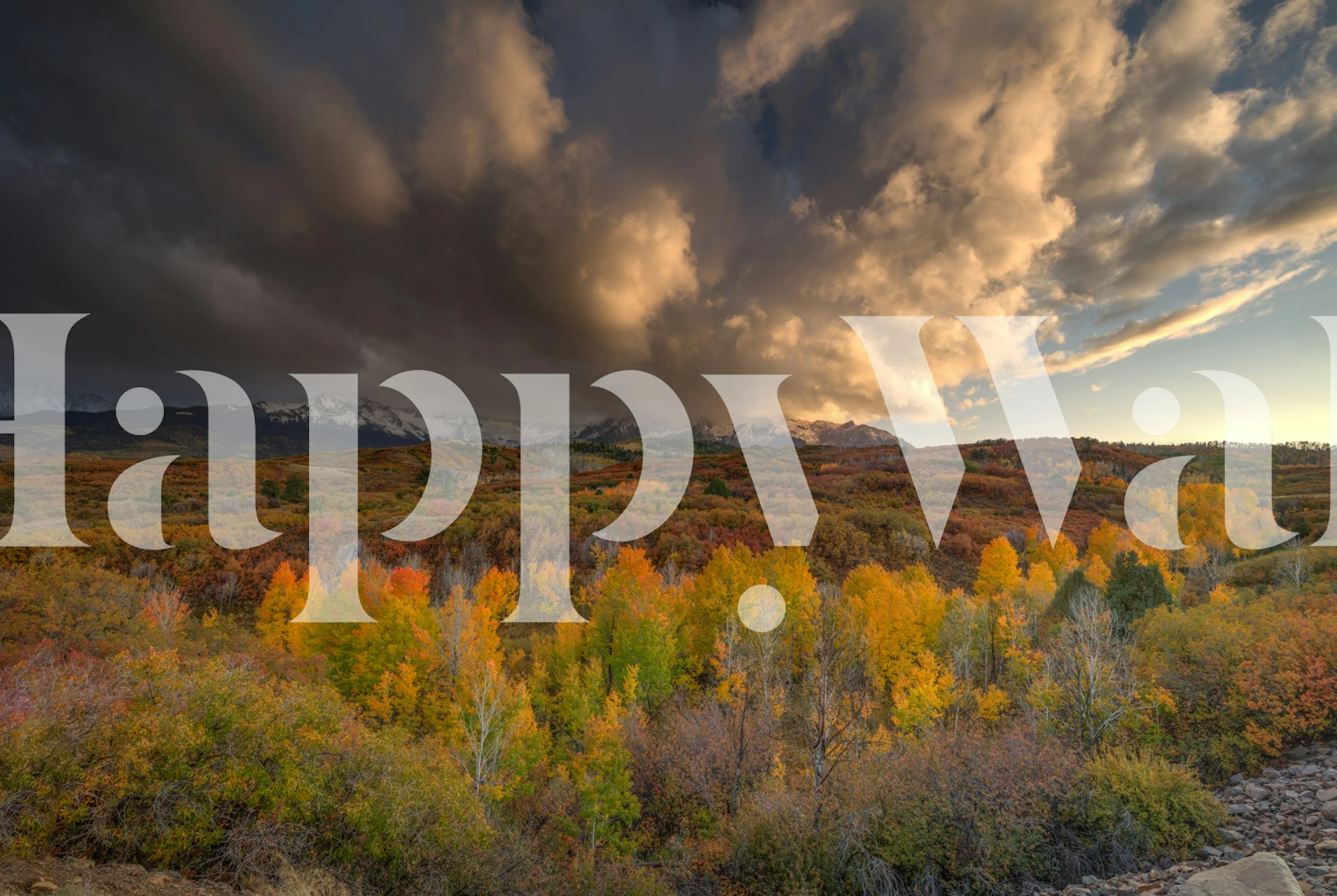 Vibrant autumn landscape with dark clouds wallpaper