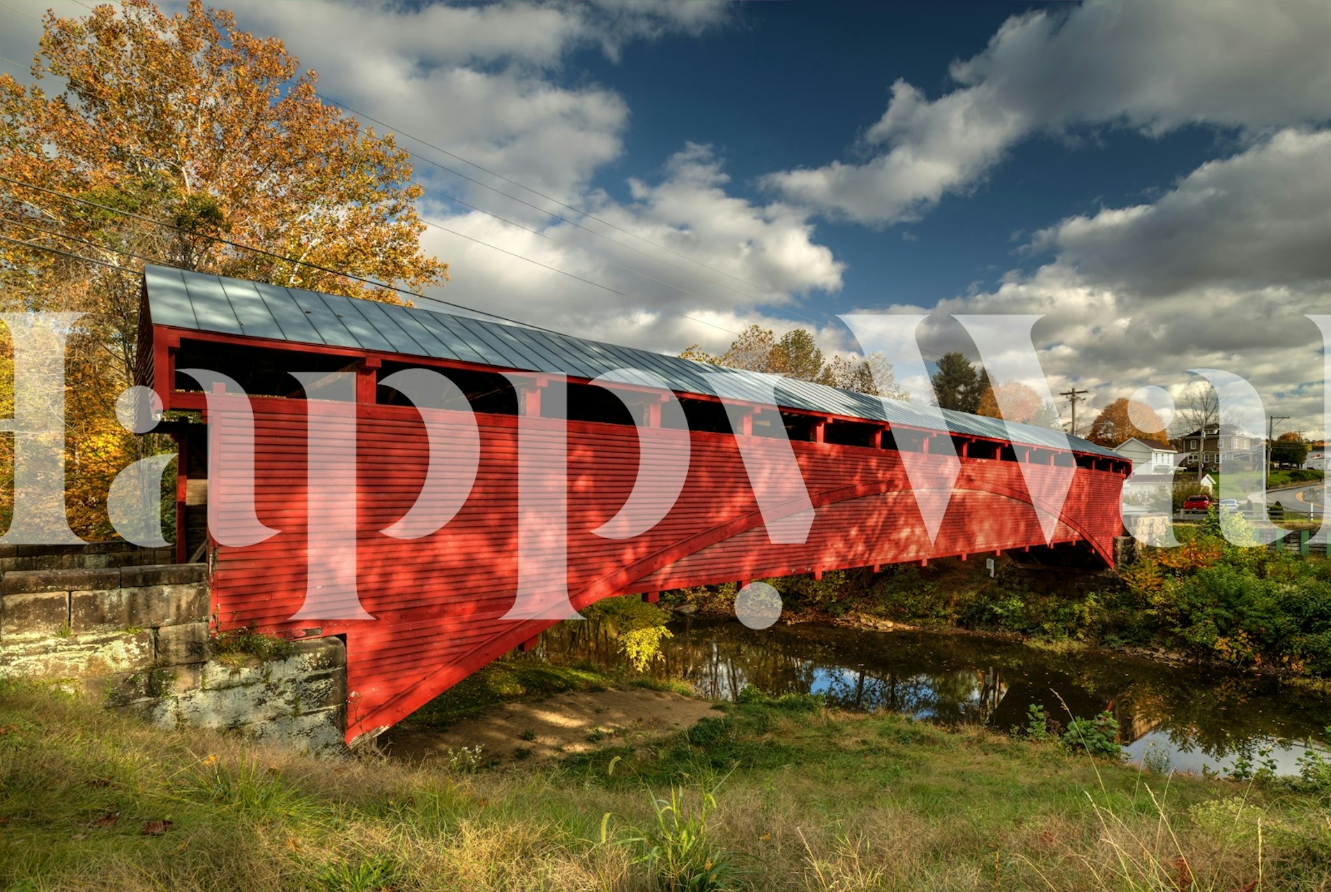 Covered red bridge over water with trees and clouds wallpaper