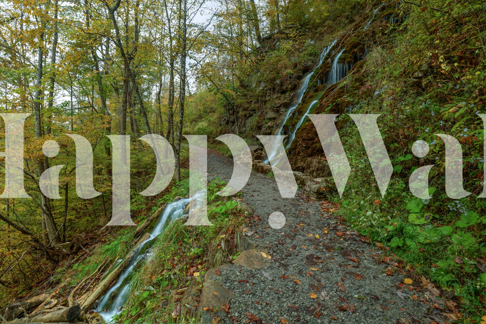 Wallpaper of a path between waterfalls