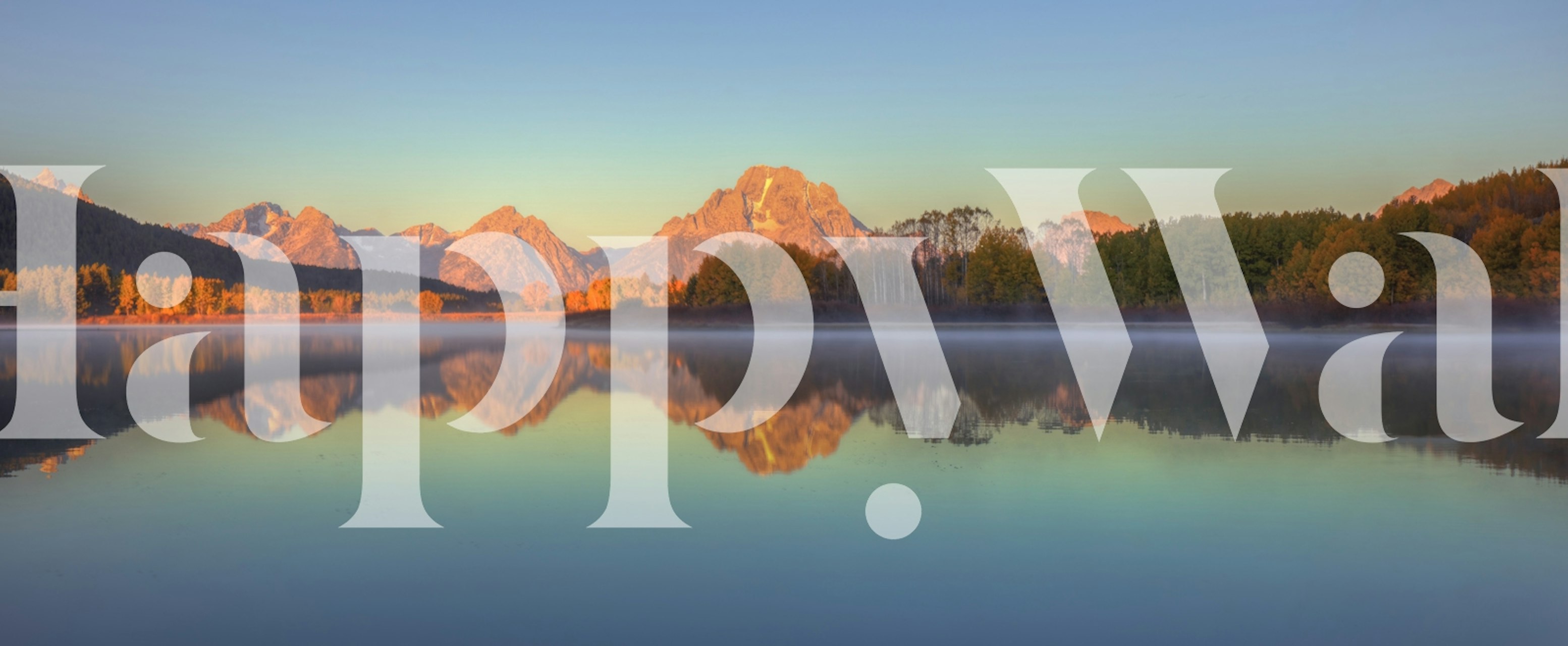 Sunrise reflection with mountains in the background and calm water in the foreground wall mural