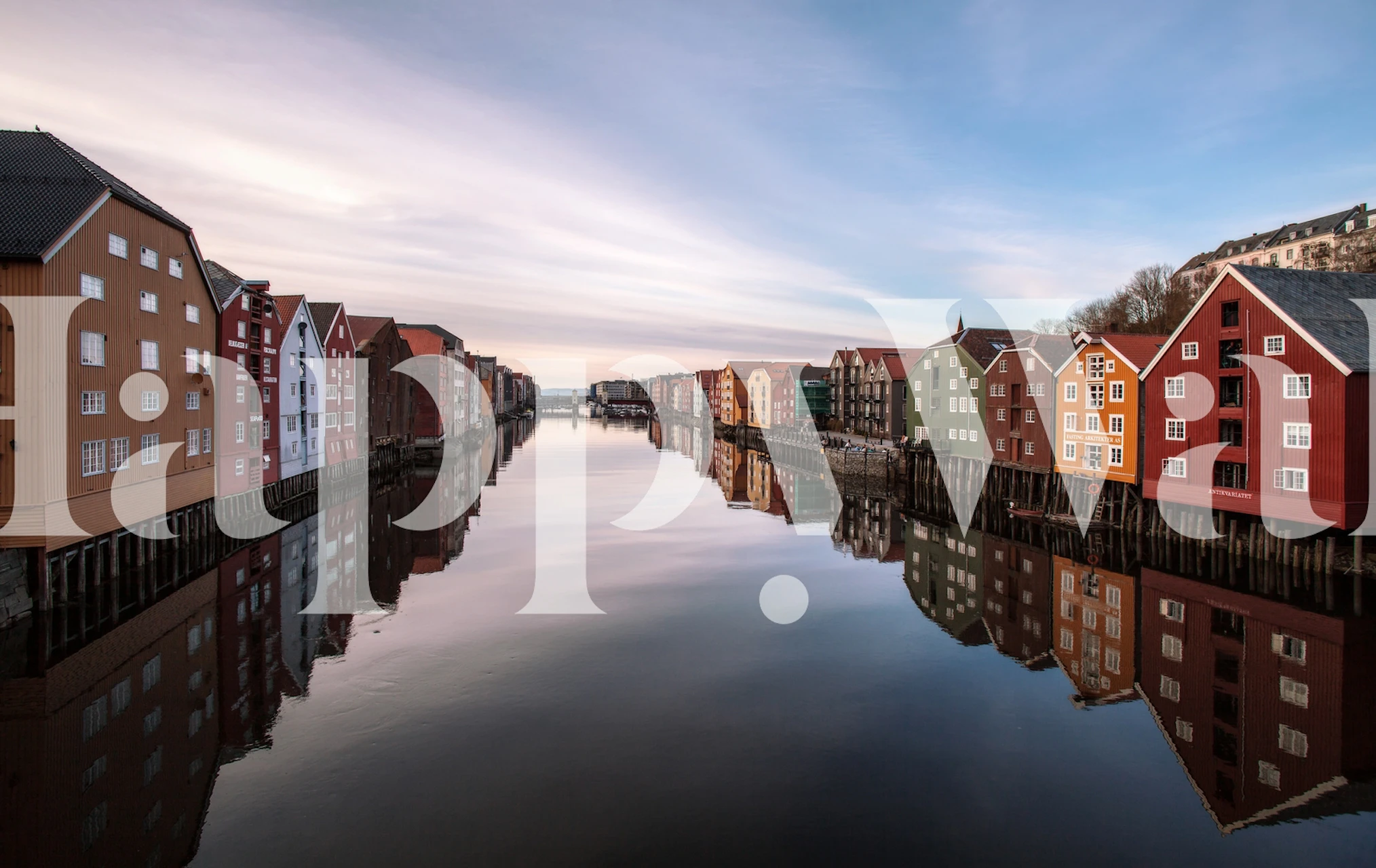 Colorful river view of Trondheim with reflected buildings on water wallpaper