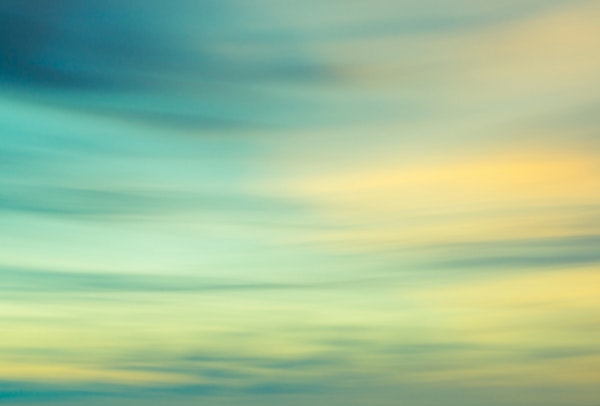 Blurred sunset sky in turquoise blue