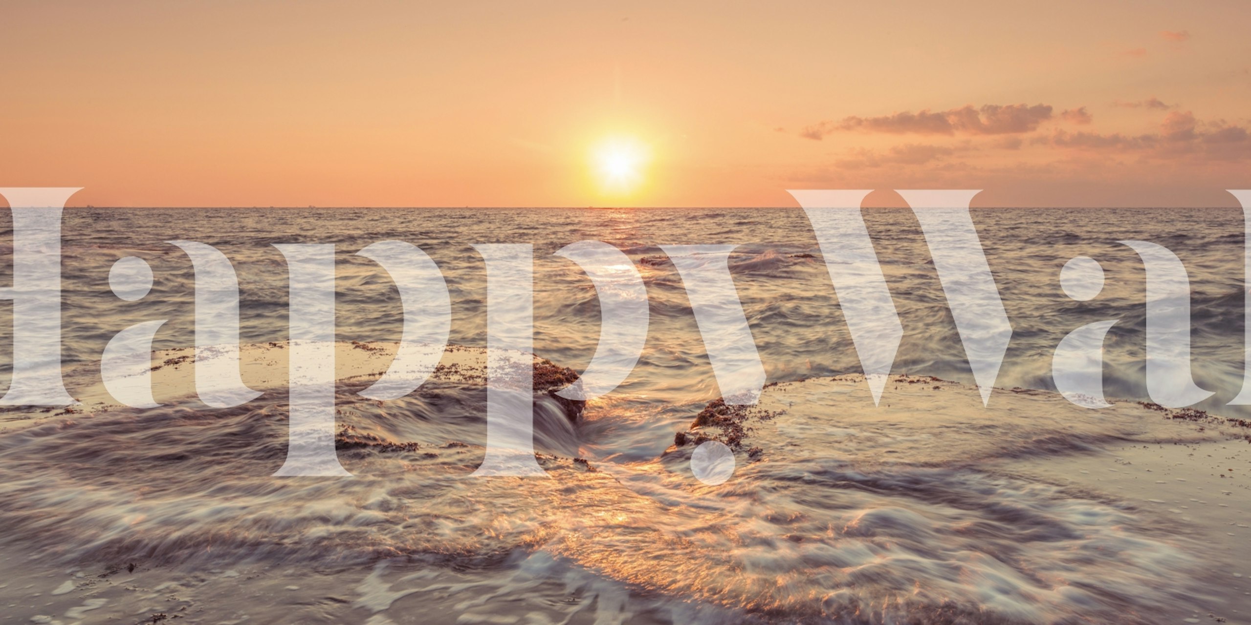 Ocean sunset with soft waves and warm hues wallpaper