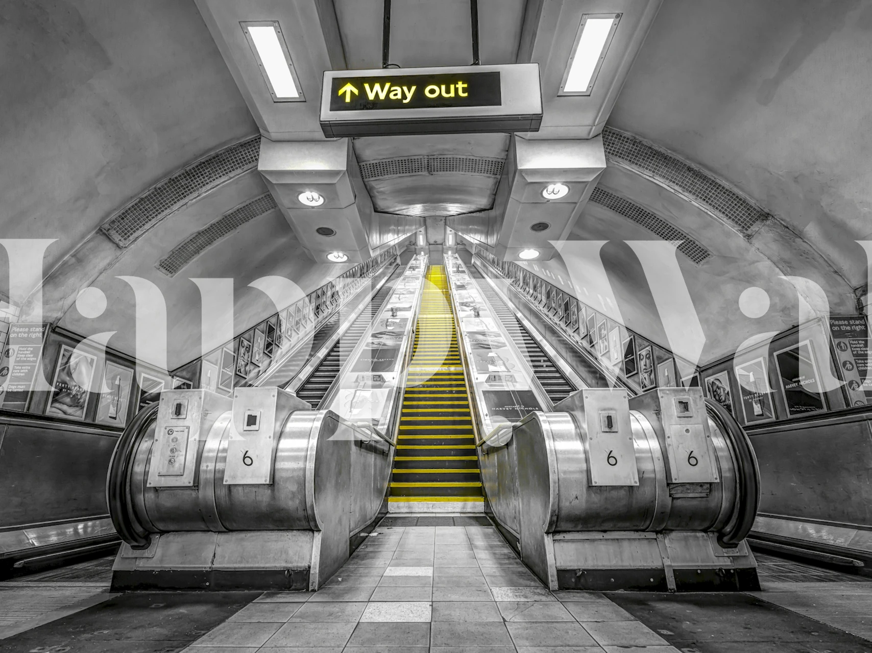 London Tube escalators in a room setting.