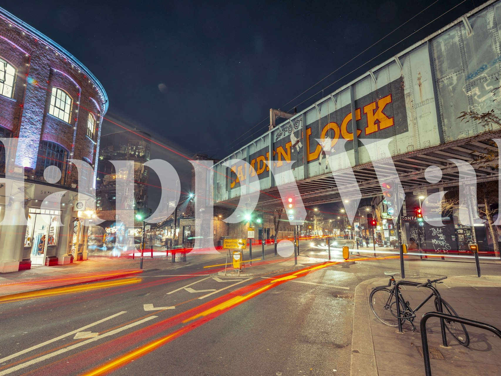 Urban night scene with Camden bridge in vibrant colors wallpaper