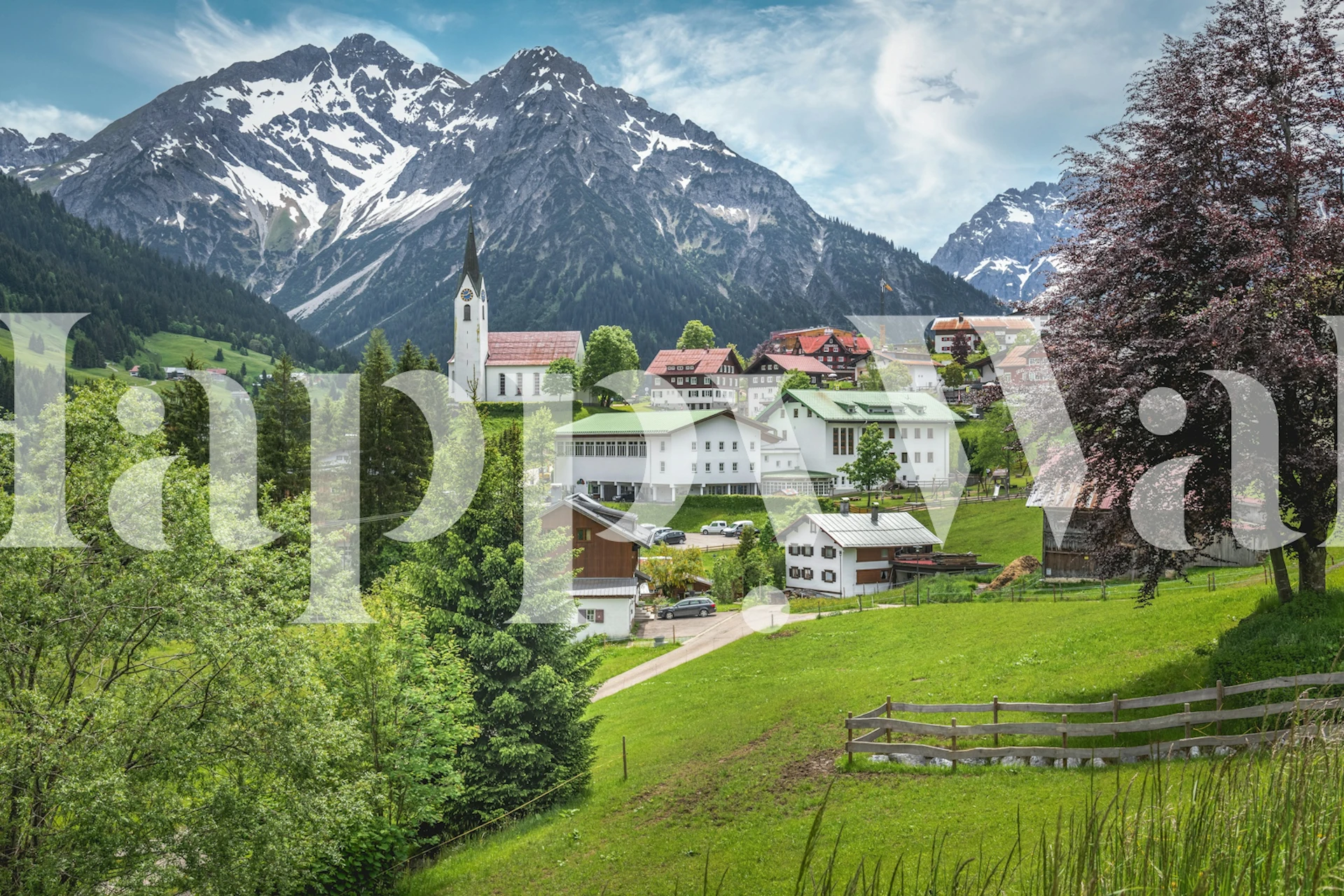 Scenic mountain landscape with green trees and blue sky wallpaper