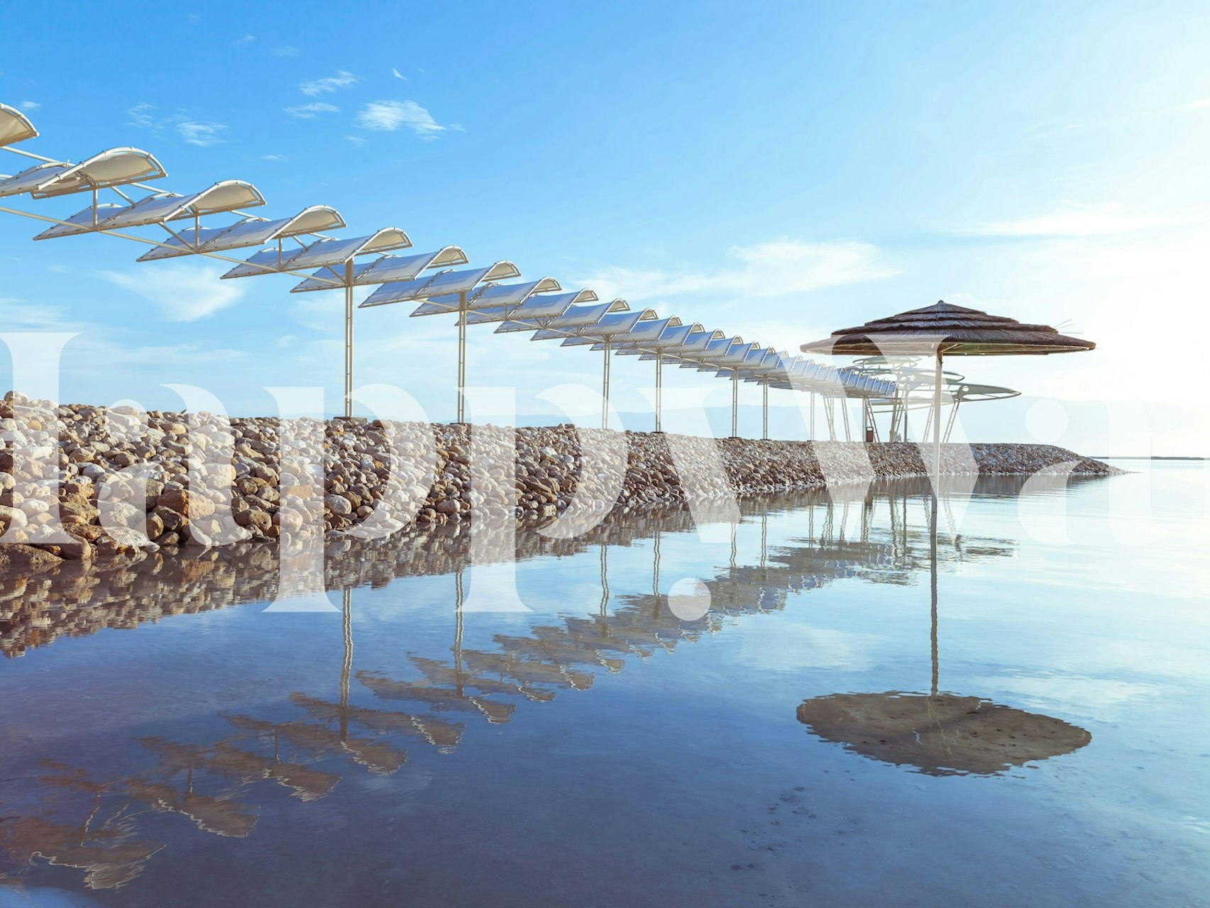 Scenic coastal view with blue sky and umbrellas wallpaper